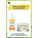 Garnier C Vitamin Serum (Niasinamid + Salisilik Asit) + C Vitamin Nemlendirici Krem & Makyaj Çantası Hediye