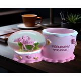 Ayder Online Satış Flamingo figürlü 15cmx10cm ebat pilli ışıklı dekoratif kar küre kalemlik