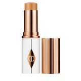 Charlotte Tilbury Unreal Skin Sheer Glow Tint 9 Tan - Nemlendirici Stick Fondöten 8 Ml