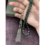 Onurlu Tesbihane Alpaka Tuğralı Asansör Püsküllü Koyu Yeşil Sıkma Kehribar Tesbih (7x11 mm) OT-SKM-KHRBR-038