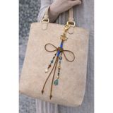 She Sells Noir Knot Luck Charm – El Yapımı Süet İpli Şans Çanta Charmı, Gold Detaylı Bohem Aksesuar